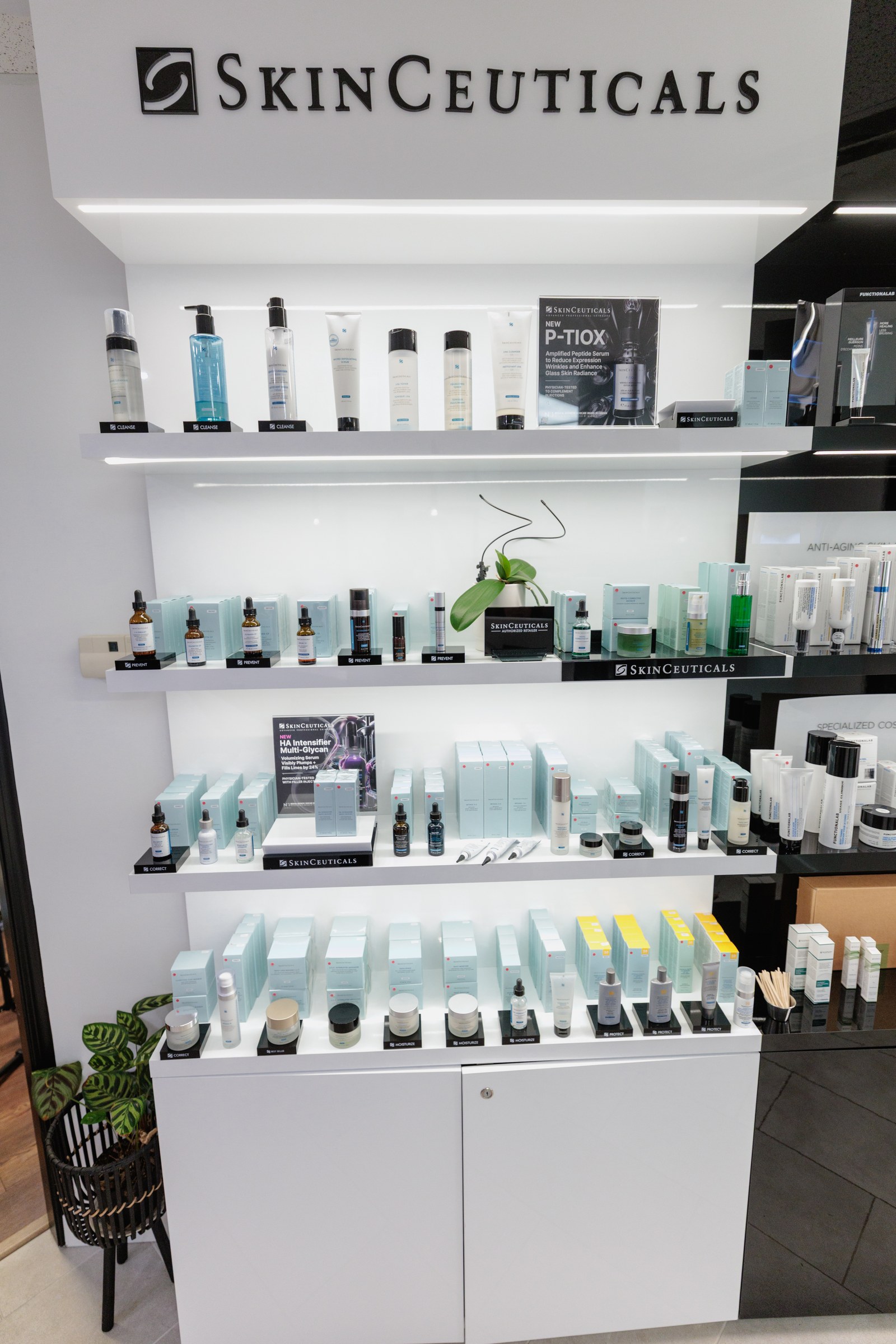 Illuminated SkinCeuticals skincare display inside a clinic